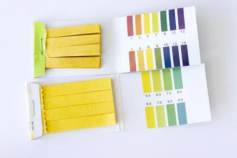 Measuring pH test strips. Two types on white background Stock Photos