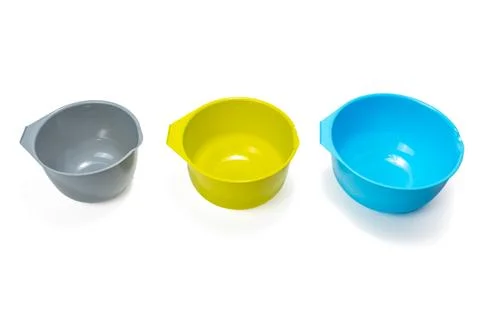 Measuring plastic cups isolated on white background. Stock Photos