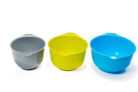 Measuring plastic cups isolated on white background. Stock Photos