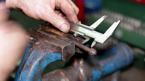 Measuring a Screw Piece with a Caliper Stock Footage 45432037