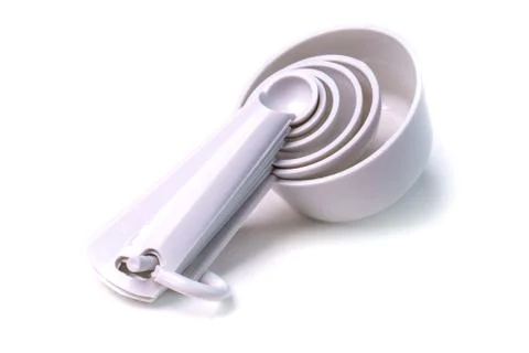 Measuring set table spoons and cups plastic white color isolated Stock Photos