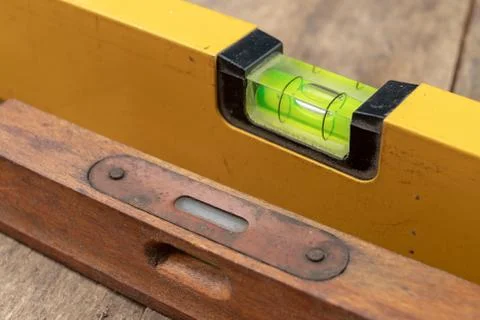 Measuring the slope of a surface using a spirit level. Measuring accessories  Stock Photos