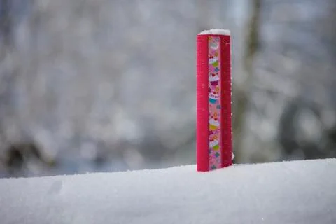 Measuring the snow 写真素材