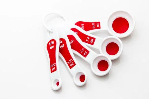 Measuring spoons on a white background. Stock Photos