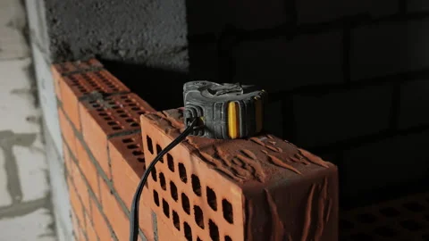 Measuring Tape on Brick Wall at Construction Site Stock Footage 321776933