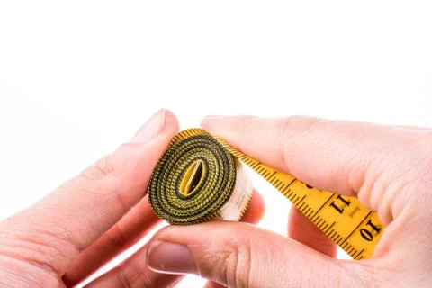Measuring tape in hand Stock Photos