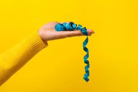 Measuring tape on hand Stock Photos