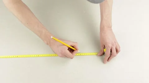 Measuring with a tape measure 스톡 동영상 60406627