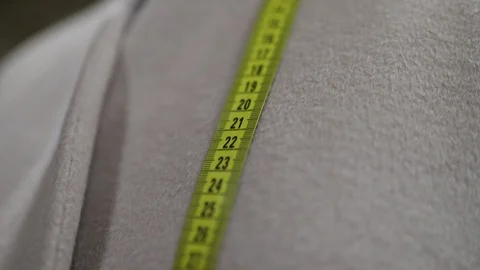 Measuring With A Tape Measure.Textile Stockbeeldmateriaal 98985206