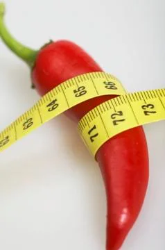 Measuring tape with peperoni Stock Photos