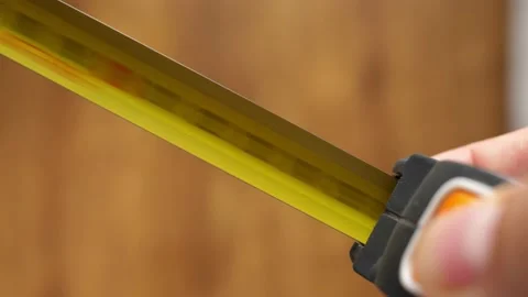 Measuring tape roller rolling, hiding pocket tape measures Stock Footage 138705335