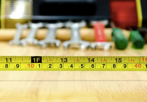 Measuring tape with set of work tools background Stock Photos