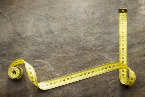 Measuring tape on table Stock Photos