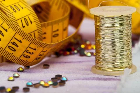 Measuring tape on textile shallow depth of field. Stock Photos