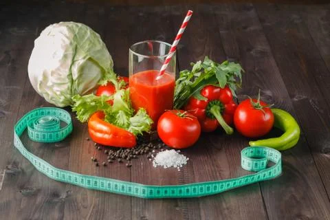 Measuring tape with tomato Stock Photos