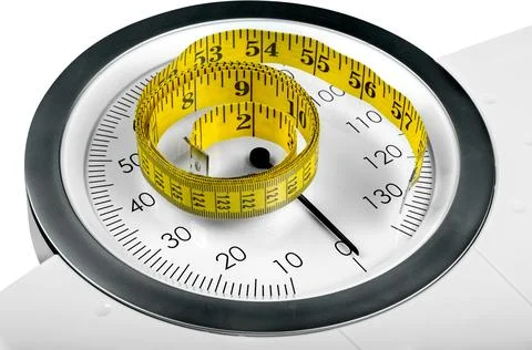 A Measuring Tape on a Weight Scale Stock Photos