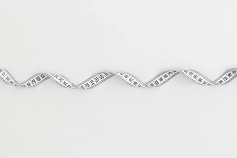 Measuring tape on white background Fotos de archivo