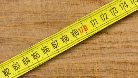 Measuring Tape on a Wooden Table Stock Footage 170065668