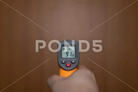 Measuring temperature with digital thermometer Stock Photos