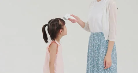 Measuring temperature with infrared thermometer,4K Stock Footage 155684667