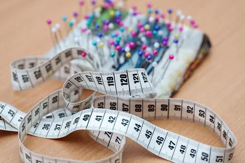 Measuring time for craft work with a pin cushion in the studio Stock Photos