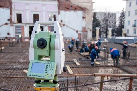 Measuring tool on a construction site. Geodesic equipment Stock Photos