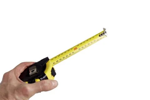 Measuring tool in hand on a white background is needed for construction Stock Photos