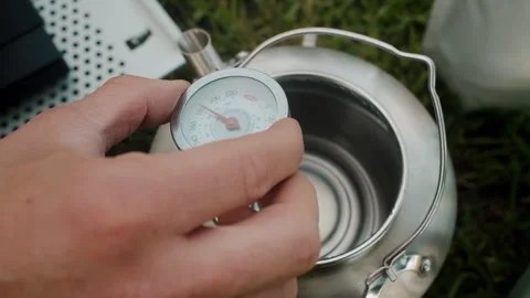 Measuring water temperature for coffee close up Stock Footage 339843222