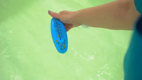 Measuring Water Temperature With A Thermometer Video stock 116202399