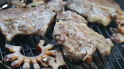 Meat and bacon on the grill Stock Footage 52134789