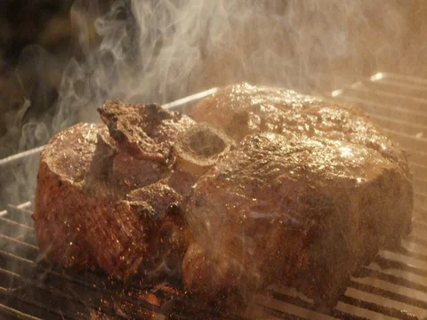 Meat and fire 2k slow motion Stock Footage 83907805