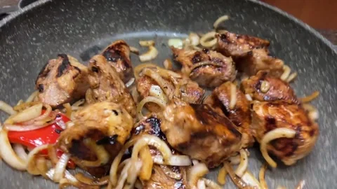 Meat and onion mixed in the pan Video stock 232381652