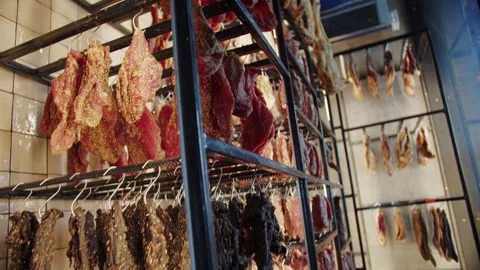 Meat and poultry hanging on curing racks Stock Footage 301526323