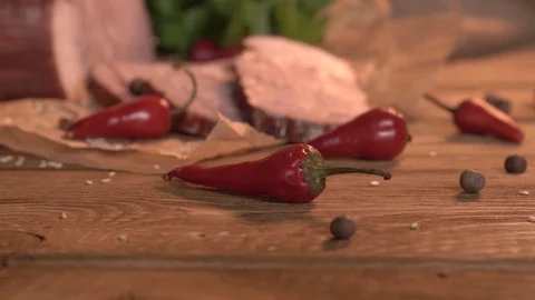 Meat and red hot chilli on wooden table Video stock 97580973