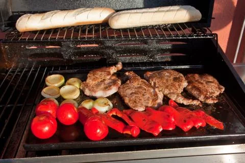 Meat and vegetable on bbq Stock Photos