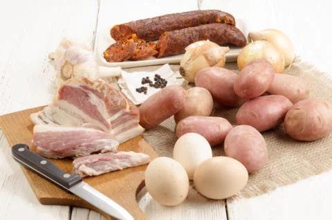 Meat and vegetable on a table Stock Photos