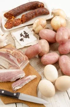 Meat and vegetable on a table Stock Photos