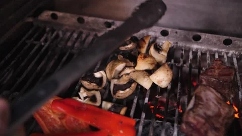 Meat and vegetables are cooked on a grill Stock Footage 159242271