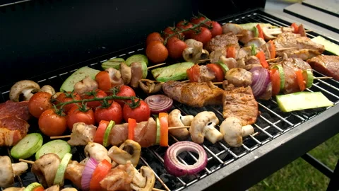 Meat and vegetables are fried on the grill. Selective focus. Stock Footage 258677459