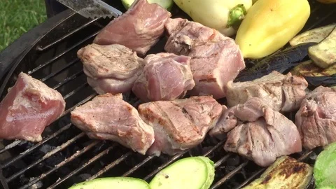 Meat and vegetables on the grill grate. B-B-Q Stock Footage 109330833