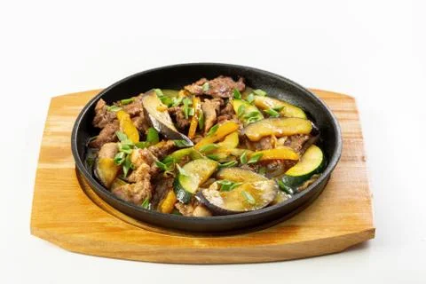 Meat and vegetables in the pan Stock Photos