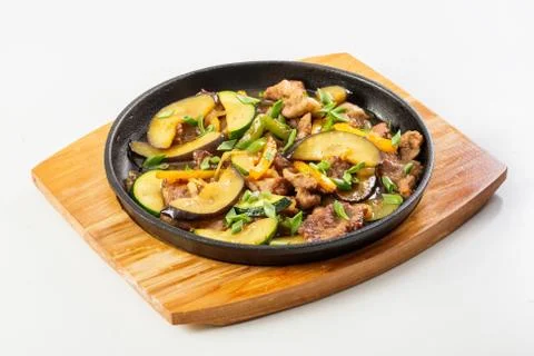 Meat and vegetables in the pan Stock Photos