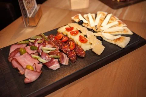 Meat appetizer on the table Stock Photos