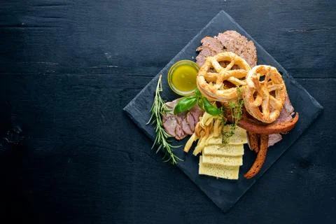 Meat assorted and cold appetizers. Ukrainian style. On a wooden background. T Stock Photos