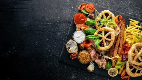 Meat assorted and cold appetizers. Ukrainian style. On a wooden background. T Stock Photos