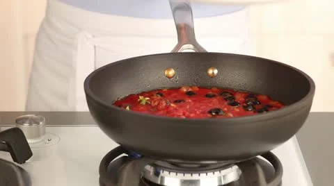 Meat balls being added to tomato sauce Video stock 24671918