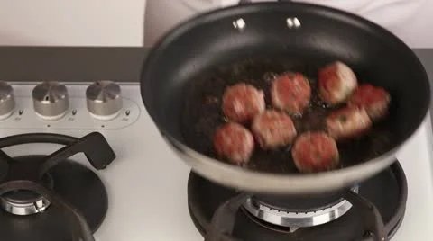 Meat balls being fried Stock Footage 24671856