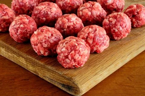 Meat balls from raw beef forcemeat on a chopping board Stock Photos