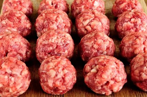 Meat balls from raw beef forcemeat on a chopping board Stock Photos