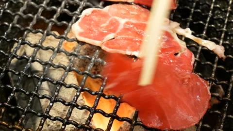 Meat barbecue concept : raw beef grill with fire on stove charcoal Stock Footage 136019826